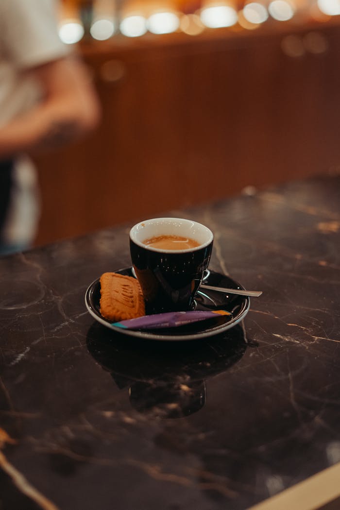 home-hero-bg A stylish shot of espresso with snacks on a marble counter in Rennes, France.